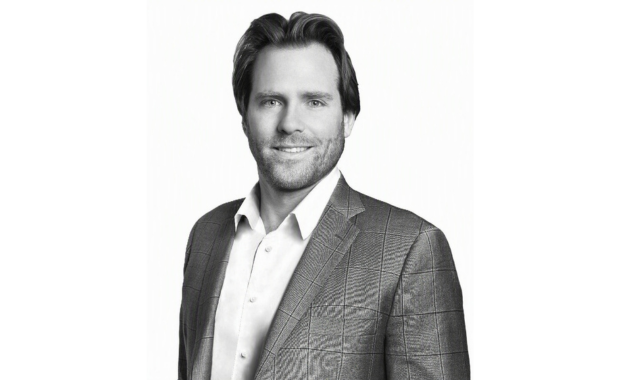 Black and white photo of Kyle MacDonald, Board Chair