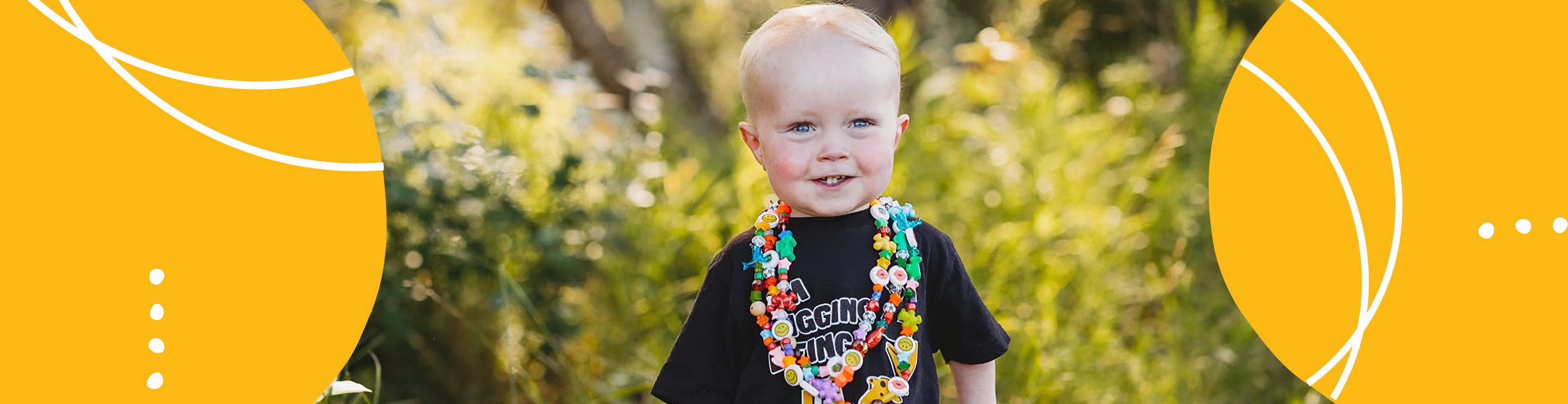 Liam, IWK patient, wearing bravery beads.
