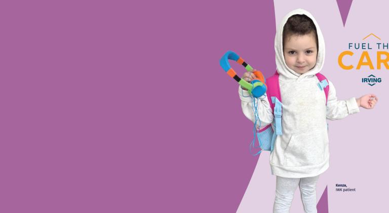 Kenza in a white hoodie holding colourful headphones, standing against a purple background.