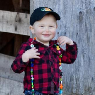 Jace, IWK patient, wearing his bravery beads.