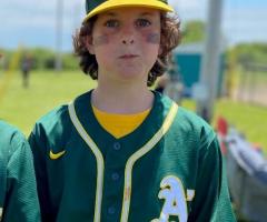 Satchel, IWK patient, in his baseball uniform.