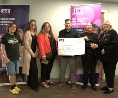ACHCCS group photo with donation cheque